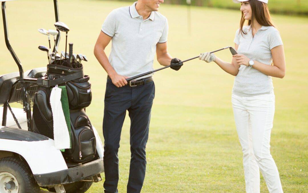 Young couple at golf cart