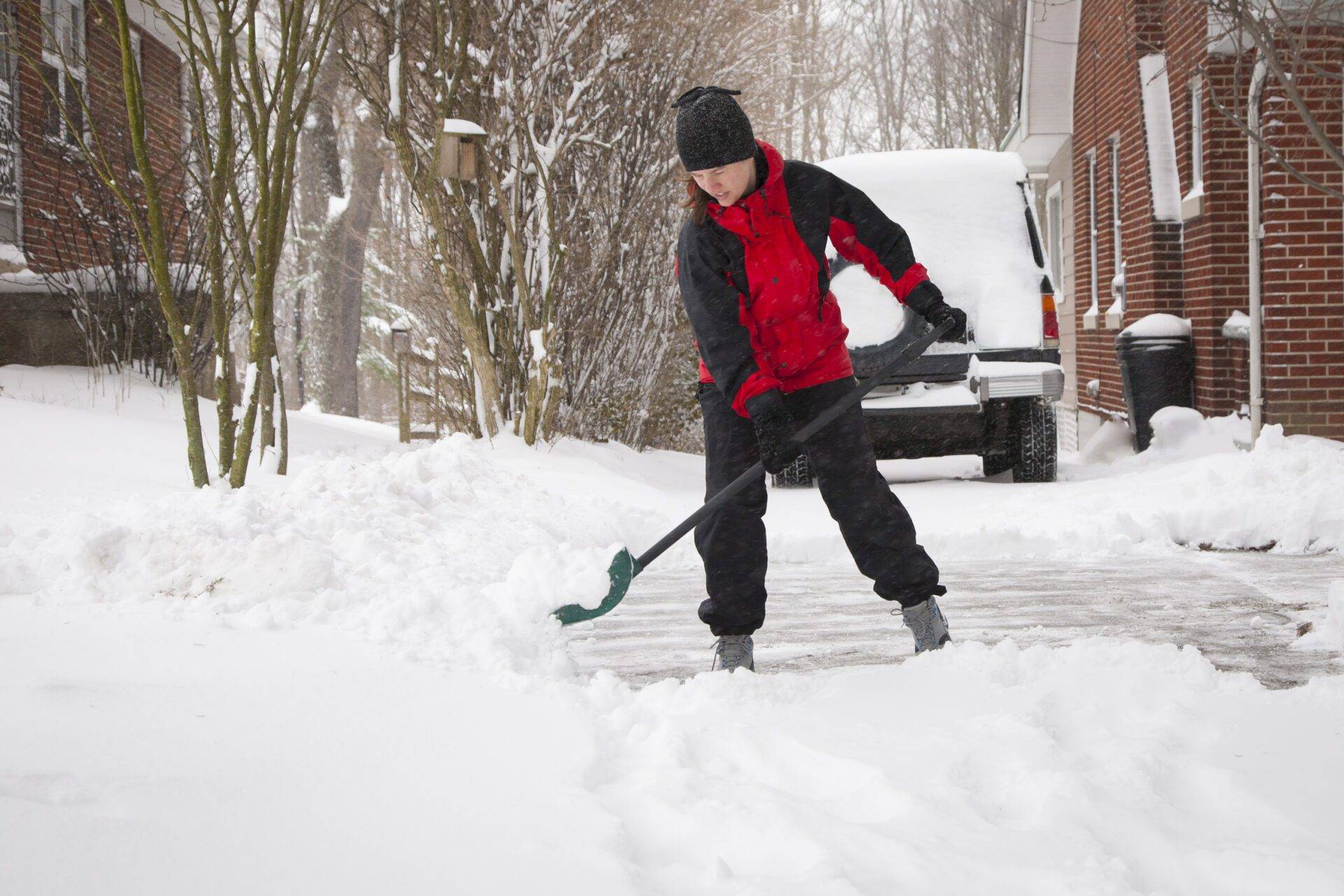 Woman Shoveling Winter Snow